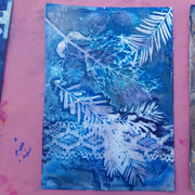 Artistic blue and white floral design on a pink background