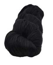 Black skein of yarn on a white background