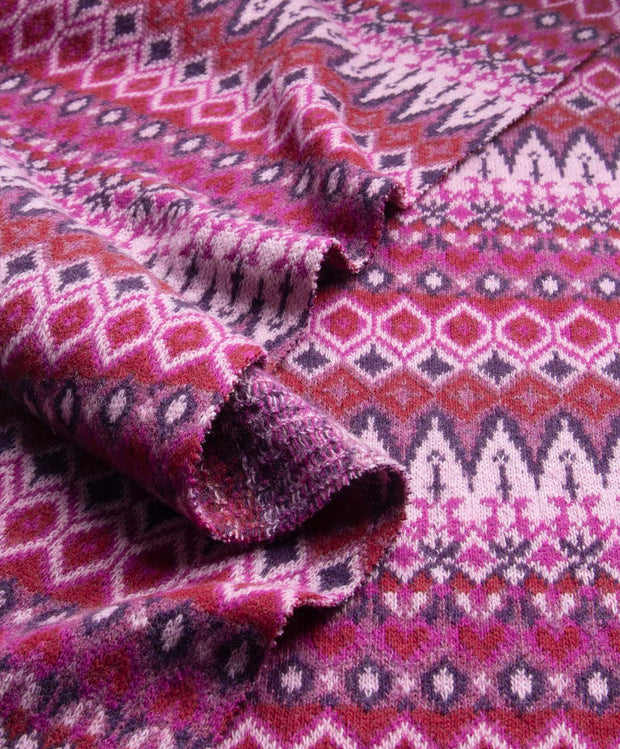 Close-up of a patterned fabric with pink and purple colors