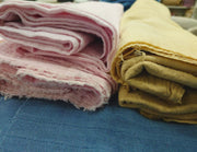 naturally dyed organic cotton bubble fabric in pink and yellow
