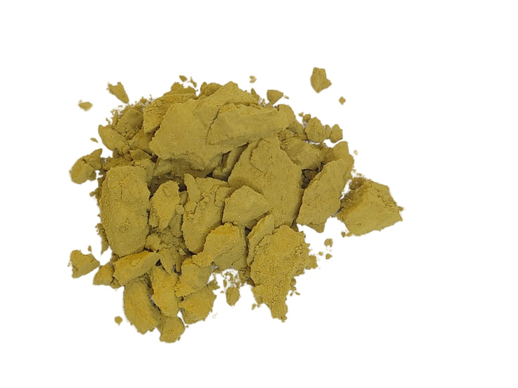 Yellow barberry root powder on a white background