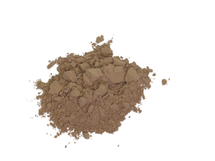 Brown quebracho powder on a white background