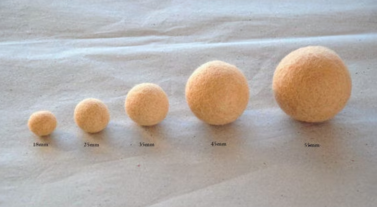 different sizes of wool felt balls