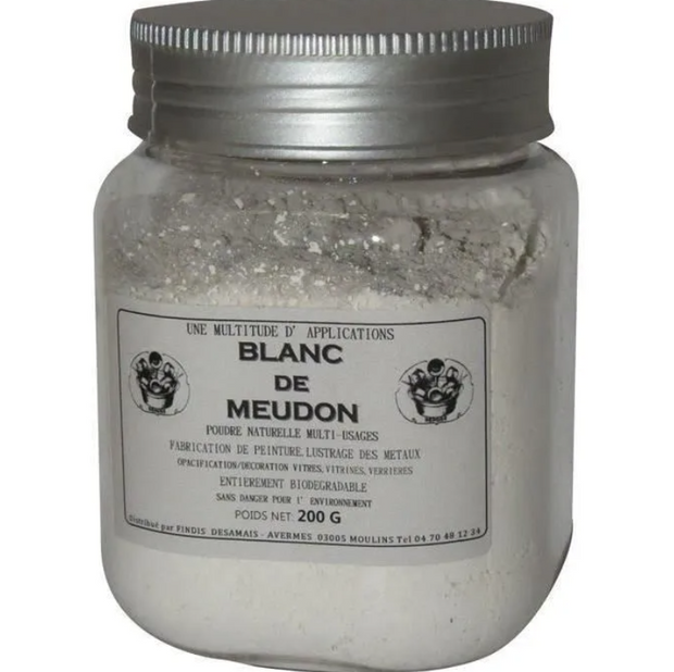 Jar of Blanc de Meudon powder with a silver lid on a white background