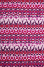Patterned fabric with a repeating geometric design in pink, purple, and white.