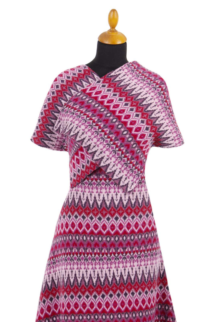 Patterned dress on a mannequin against a white background