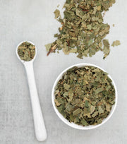 cut birch leaves on a spoon and in a bowl