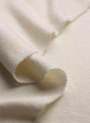 Close-up of beige fabric with a textured surface