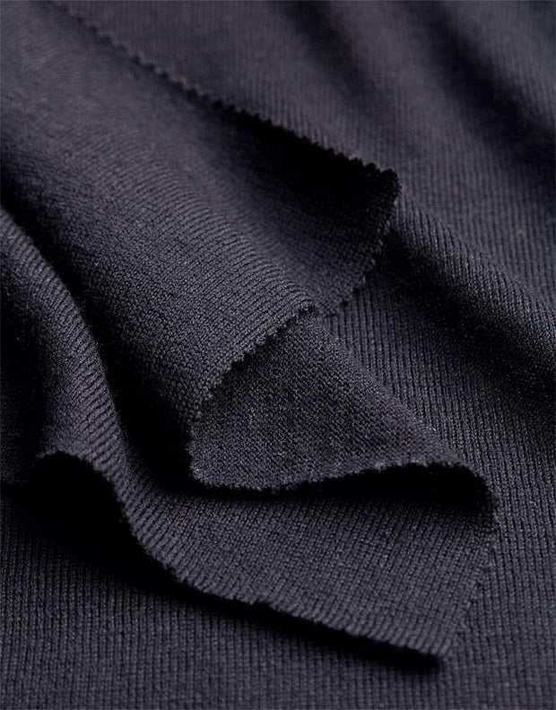 Close-up of dark gray wool fabric with a textured pattern