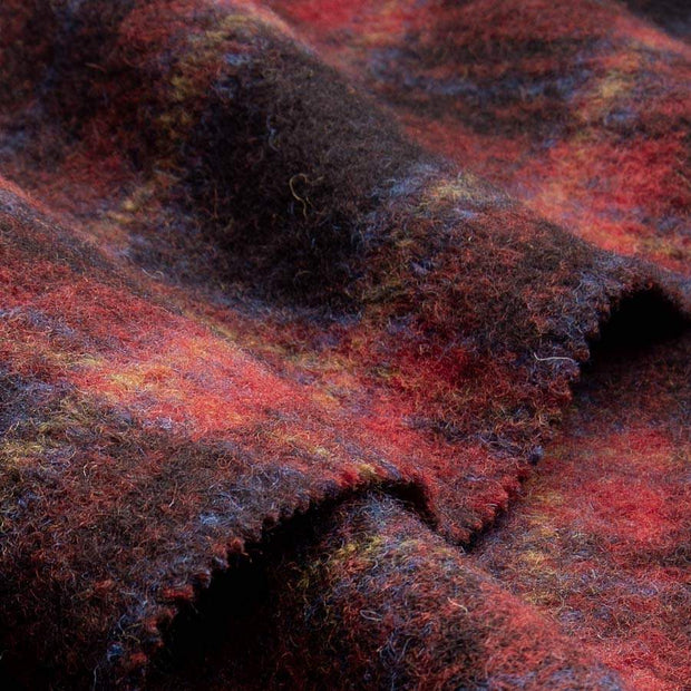Close-up of textured fabric with red and brown colors