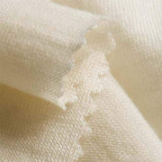 Close-up of beige merino wool fabric texture