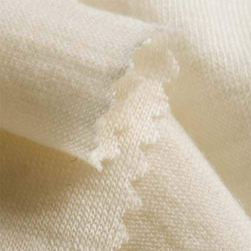 Close-up of beige merino wool fabric texture