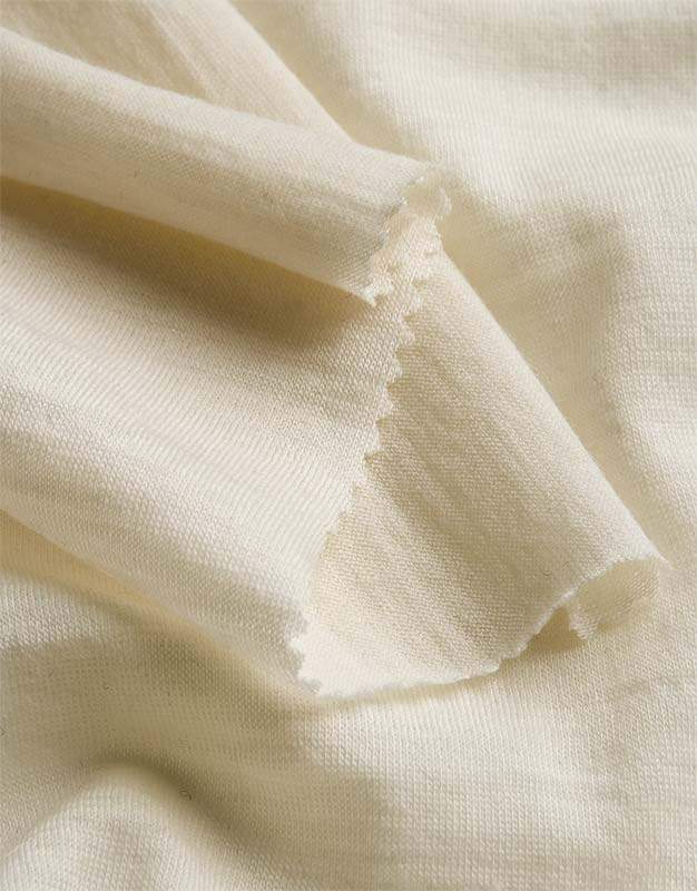 Close-up of beige merino wool fabric with a soft texture