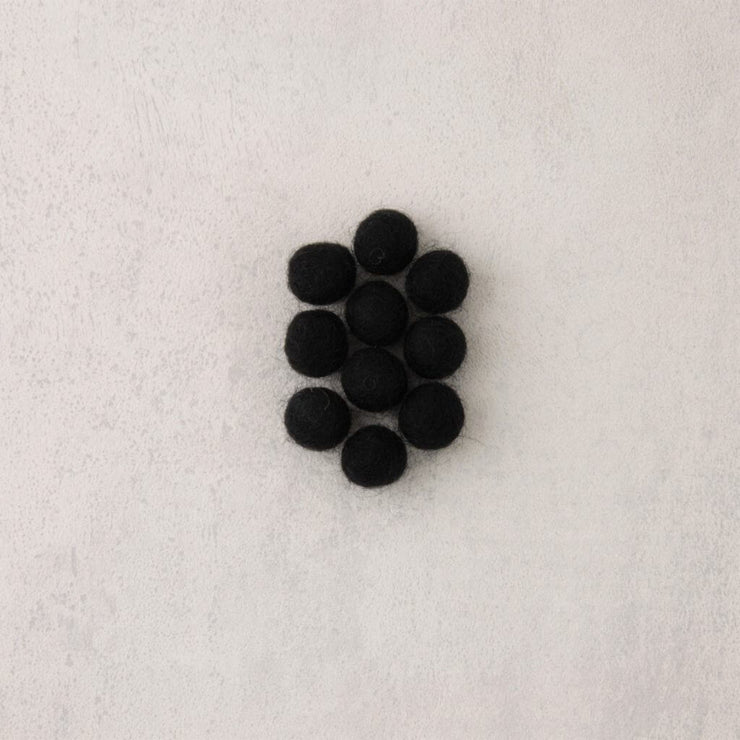 Black felt beads